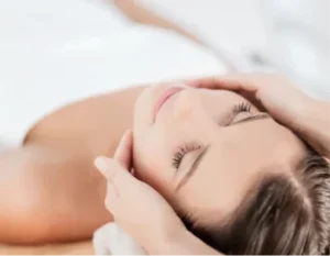 Woman receiving a relaxing facial massage